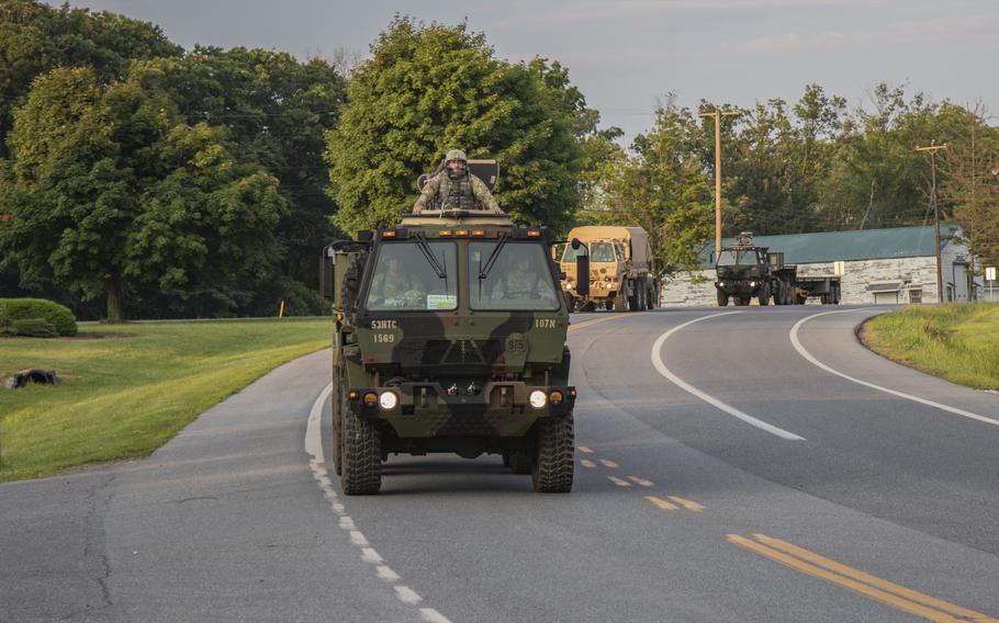 New York National Guard soldiers with the 1569th Transportation Company, 369th Sustainment Brigade, are pictured in a convoy in Light Medium Tactical Vehicles on the way to a field training exercise in July 2018 at Fort Indiantown Gap, Pa. A crash involving a pair of the vehicles during a training exercise at the base Saturday, Oct. 22, 2022, left one Pennsylvania National Guard soldier dead and three others injured, Guard officials said.