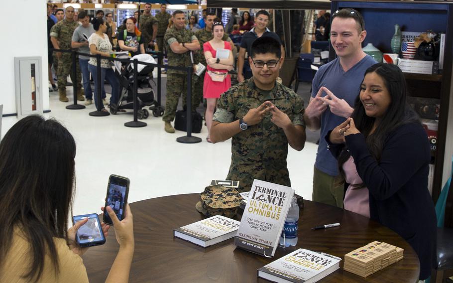 "Terminal Lance" creator Maximilian Uriarte poses with fans at Camp Pendleton, Calif., May 4, 2018.