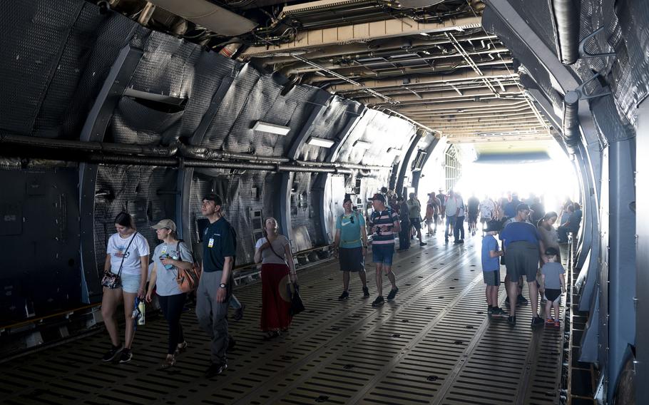 Spectators explore a C-5 Super Galaxy as part of the Warriors over the Wasatch air show at Hill Air Force Base, Utah, June 29, 2024. 