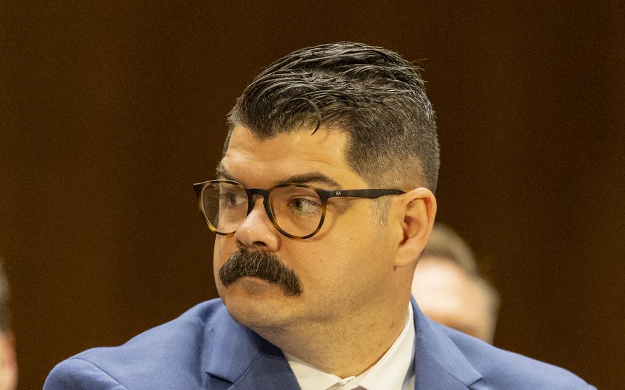 Crow turns his head and listens during the hearing.