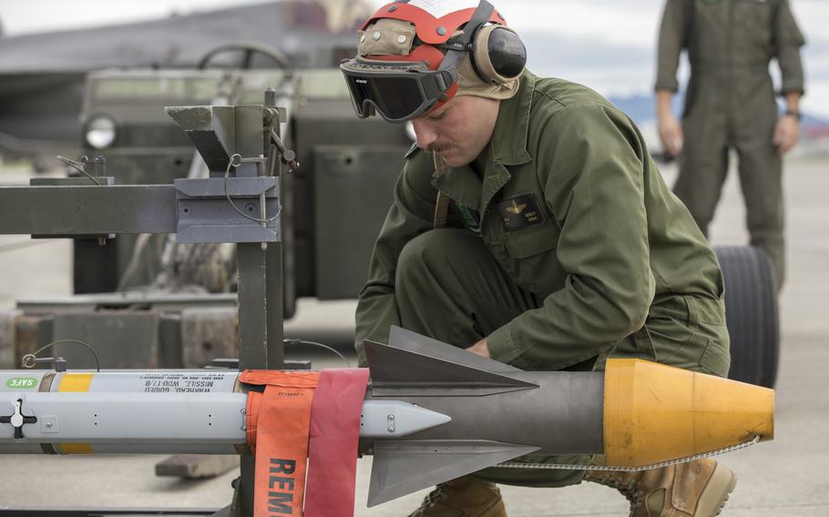 U.S. Marine Corps Cpl. Devin Gould, an aircraft ordnance technician with Marine Fighter Attack Squadron (VMFA) 121, prepares an AIM-9X Sidewinder missile at Marine Corps Air Station Iwakuni, Japan, Sept. 28, 2022.