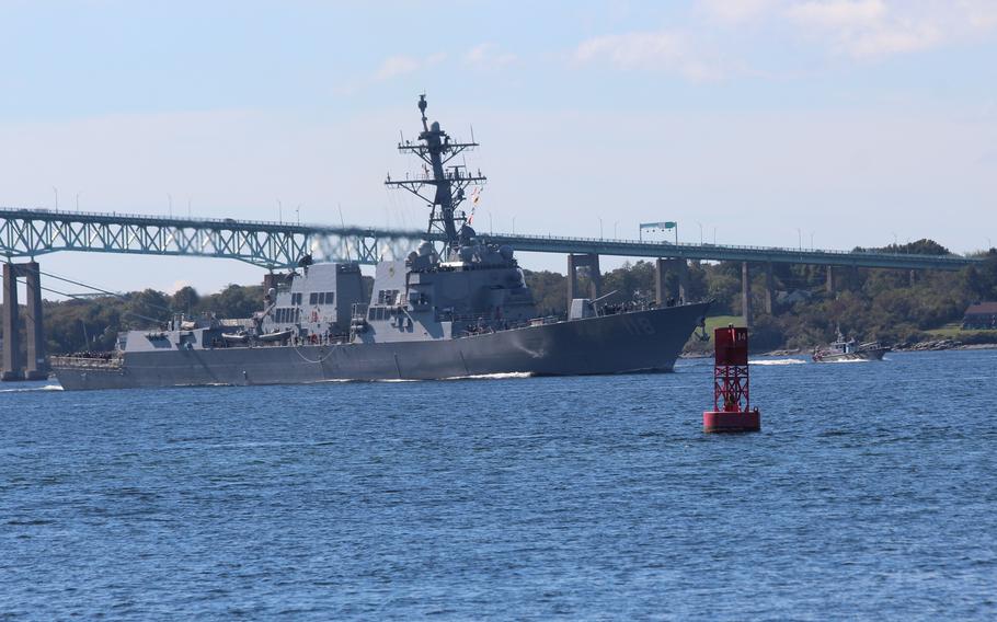 The future USS Daniel Inouye passes beneath the Clairborne Pell Newport Bridge as it approaches Naval Station Newport, R.I., on Oct. 7, 2021.