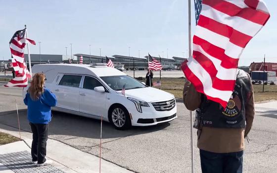 Community members gather outside Gerald R. Ford International Airport in Grand Rapids, Mich., on Monday, Feb. 26, 2024, as the body of U.S. Marine Capt. Miguel Nava was brought home.