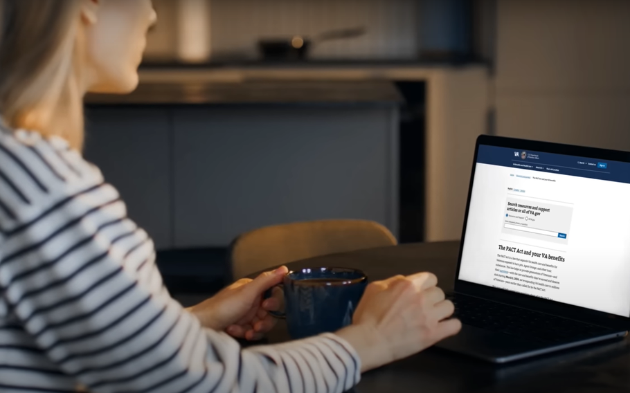 A woman typing on a laptop