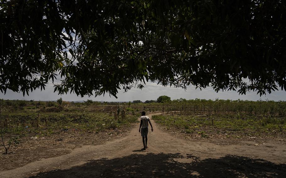 .A. walks home in a village near Pemba, Mozambique, on Sept. 2, 2022.
