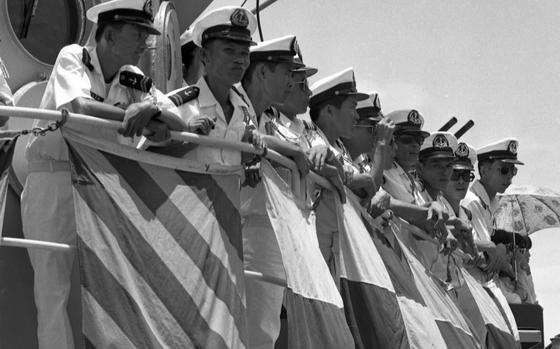 D Nang, South Vietnam, Aug. 15, 1968: Vietnamese sailors watch hundreds of Vietnamese fishermen from the coast villages near the Army of the Republic of Vietnam's I Corps' base in Da Nang take part in boat races with their fishing boats. The colorful event was part of ARVN I Corps' 11th anniversary activities.

Looking for Stars and Stripes’ coverage of the Vietnam War? Subscribe to Stars and Stripes’ historic newspaper archive! We have digitized our 1948-1999 European and Pacific editions, as well as several of our WWII editions and made them available online through https://starsandstripes.newspaperarchive.com/

META TAGS: Pacific; Vietnam War; South Vietnam; ceremony; exercise; anniversary; parachute; sky diving; river; boats