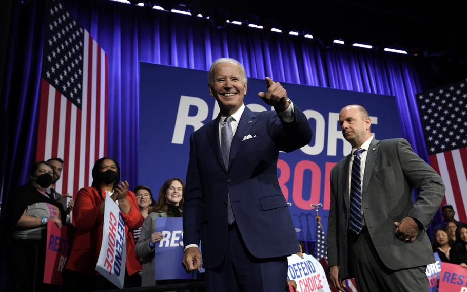 President Joe Biden greets the audience after speaking at a political event at the Howard Theatre in Washington, D.C., on Tuesday, Oct. 18, 2022. 