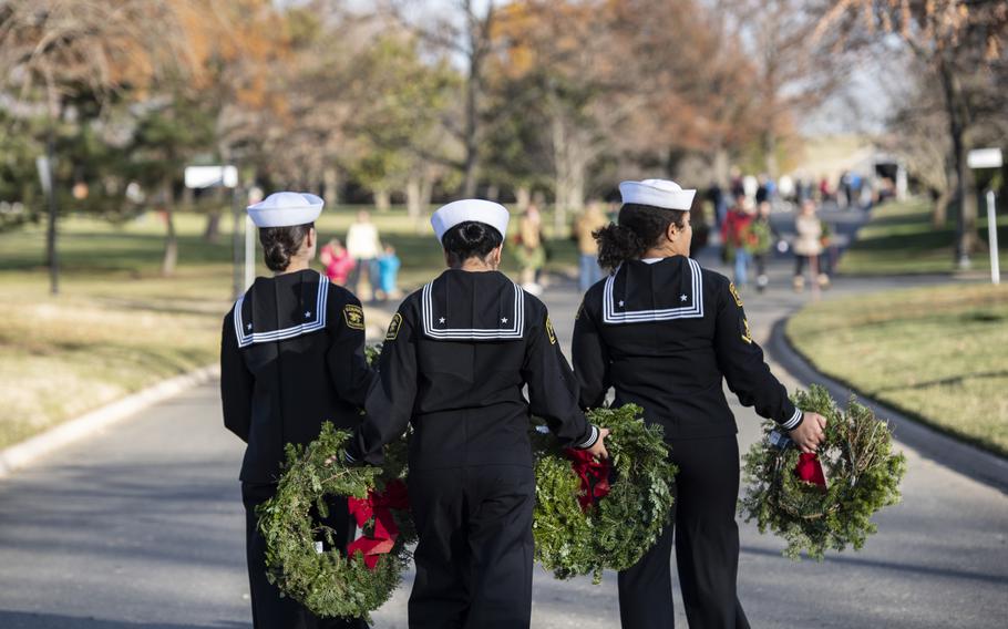 Volunteers participate in the 32nd Wreaths Across America Day at Arlington National Cemetery, Arlington, Va., Dec. 16, 2023. 