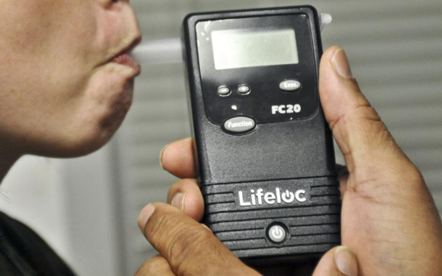 A Marine takes a breath test in 2013 in Quantico, Va. 