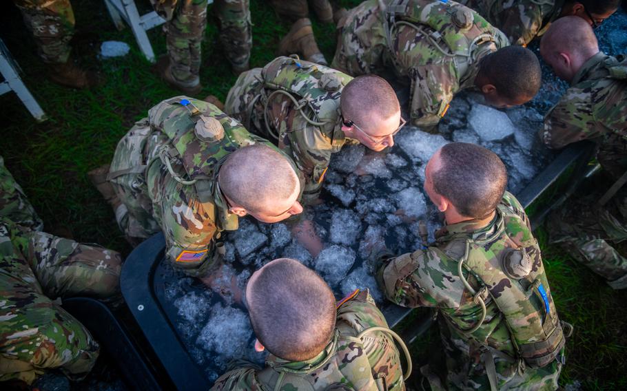 Basic trainees with E-Troop, 5th Squadron, 15th Cavalry Regiment, 194th Armored Brigade participate in the Thunder Run on June 29, 2023, at Fort Moore, Ga. The Thunder Run requires Armor recruits on their first day of training to work under time pressure to find the fastest, most efficient way to move an assortment of equipment by carrying it at a run along a quarter-mile track, handing off to teammates at four points along the way, then setting the items down at the end in the same way they were arranged. 