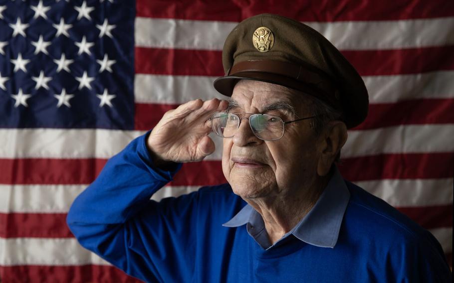 Alfred Arrieta, 100, who served as a waist gunner in a Flying Fortress during World War II, offers up a salute from Seal Beach, Calif., on May 26, 2023.