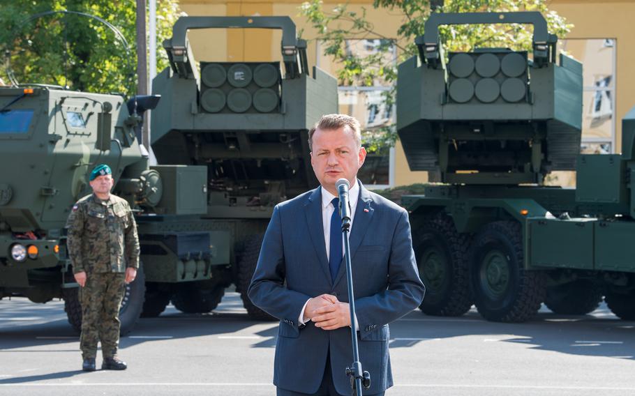 Polish Defense Minister Mariusz Blaszczak speaks at a signing ceremony in Torun, Poland, on Sept. 11, 2023, marking a framework agreement for Poland’s acquisition of M142 HIMARS missile launcher components for the HOMAR-A system.