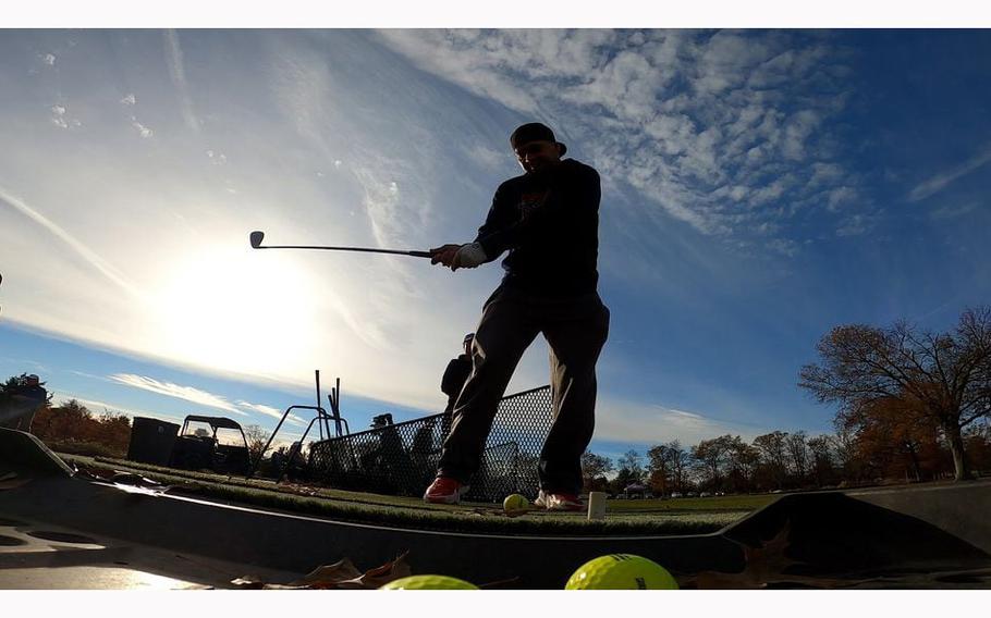 Navy Veteran Jose Renderos-Kieffer takes a swing at the Golf Range & Activity Center located on the Lyons Campus of the VA New Jersey Health Care System, in Bernards Township. 
