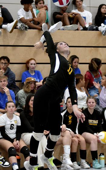 Stuttgart's Mia Snyder jumps while serving during a scrimmage on Sept. 1, 2023, at Ramstein High School on Ramstein Air Base, Germany.