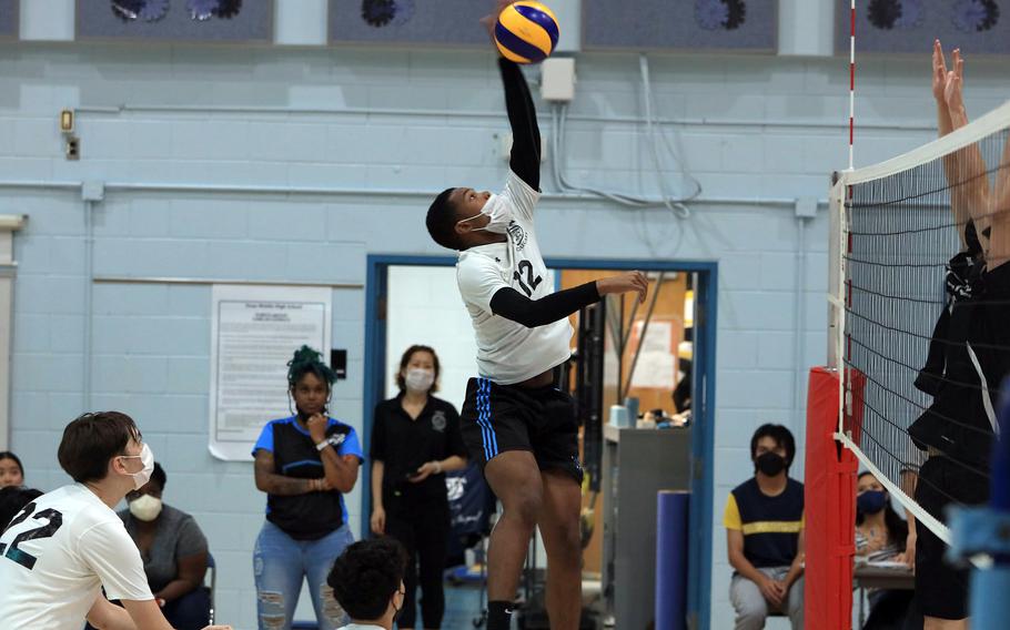 Osan's Tzuriel Jennings goes up to spike against Taejon Christian during Saturday's Korea boys volleyball match. The Cougars won in three sets.