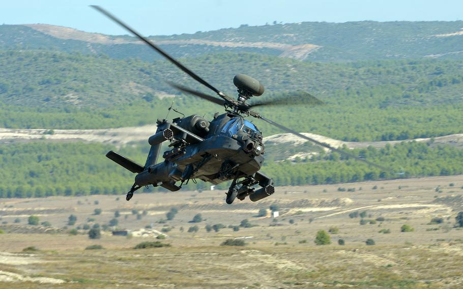 A U.S. Army AH-64 Apache helicopter flies over the San Gregorio training area near Zaragoza, Spain, during a NATO exercise in 2015. The Apache is one of many military aircraft that did not meet mission capable goals, according to a Government Accountability Office report issued Nov. 10, 2022.