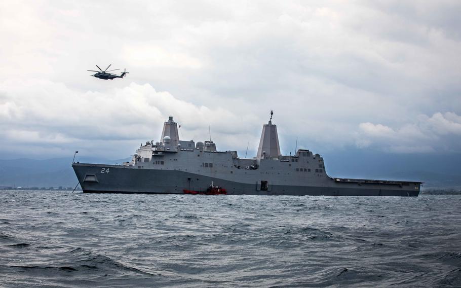 A CH-53E Super Stallion helicopter, assigned to Marine Medium Tiltrotor Squadron 263, flies over the San Antonio-class amphibious transport dock ship USS Arlington, May 3, 2022, in the Aegean Sea. Arlington is participating in exercise Alexander the Great 2022. 