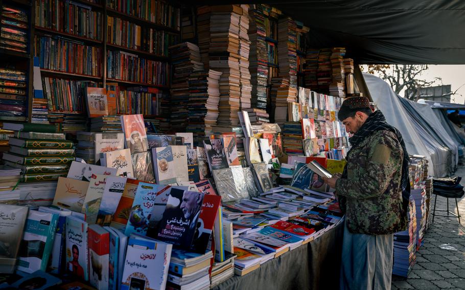 A former Taliban fighter, now part of the government military and resettled in Kabul, shops for history and self-help books.