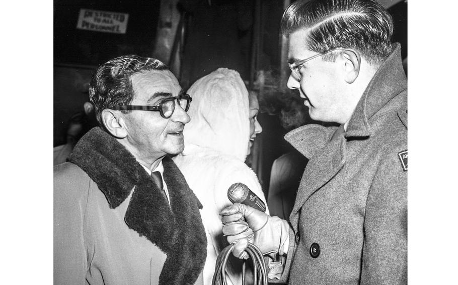 Songwriter Irving Berlin, left, talks with an AFN Radio reporter upon his arrival in Wiesbaden, Germany, in December 1948, to take part in Bob Hope’s “Christmas Caravan” of Hollywood stars. Berlin made his mark in American Christmas tradition as the composer of “White Christmas,” popularized by Bing Crosby.