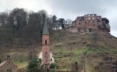 The Protestant church and the ruins of Frankenstein Castle tower over the German town of the same name, Jan. 23, 2022.

