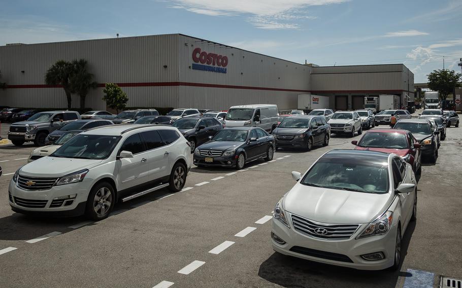 Drivers queue at a Costco in Lantana, Fla., on May 12, 2021., following a ransomware attack on US east coast gasoline supplier Colonial Pipeline that caused supply shortages in multiple states.