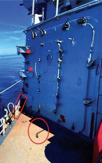 The place where a sailor whose name was redacted in a Naval Criminal Investigative Service report believes Seaman Recruit David Spearman fell overboard from the USS Arleigh Burke into the Baltic Sea on Aug. 1, 2022. The red dots mark a freshly sanded area, the red circle the spot where a sander was left and the red square marks the spot Spearman might have stood.