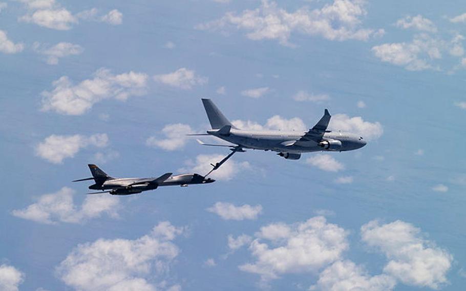 A Royal Australian Air Force KC-30A multirole tanker refuels an Air Force B-1 Lancer bomber over Australia's Northern Territory, Monday, Nov. 8, 2021. 