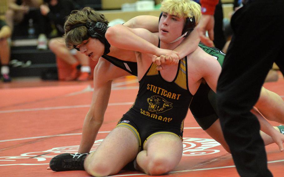 AFNORTH’s Ethan Edwards, left, and Stuttgart’s Witt Hennig grapple in a 215-pound match won by Hennig at the high school 2022 Wrestling Tournament in Kaiserslautern.
