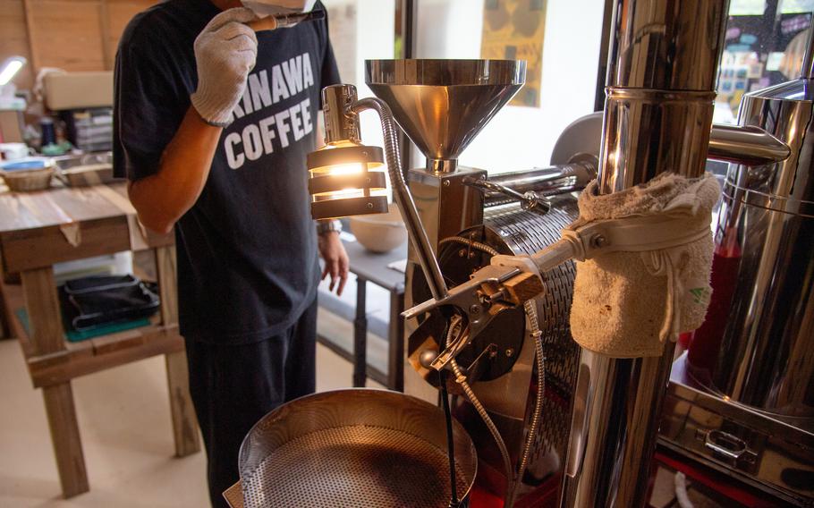 A worker checks the coffee beans' aroma for quality at Matayoshi Coffee Farm on Okinawa, July 17, 2025.