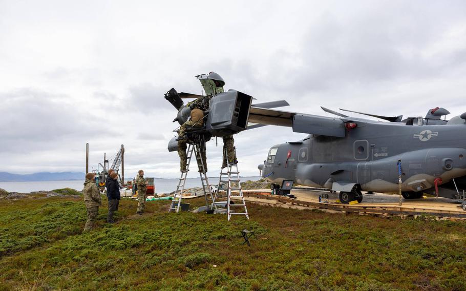 U.S. and Norwegian crew members prepare an Osprey aircraft engine for transport on Senja island, Norway, in September. The Osprey had been stuck on the remote island after an emergency landing Aug. 12. 