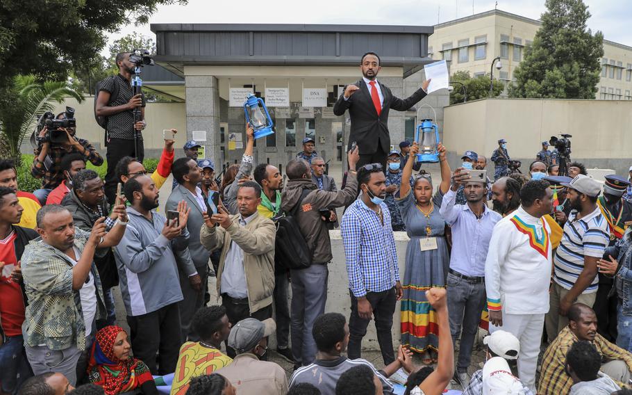 Ethiopians protest against the United States outside the U.S. embassy in the capital Addis Ababa, Ethiopia Thursday, Nov. 25, 2021. Ethiopia’s government on Thursday warned the United States against “spreading false information” as fighting in the country’s yearlong war draws closer to the capital, while thousands protested outside the U.S. and British embassies.