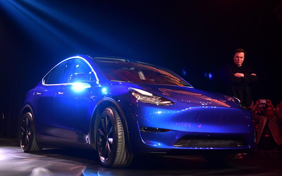 Tesla CEO Elon Musk walks beside the new Tesla Model Y at its unveiling in Hawthorne, California on March 14, 2019. (Photo by Frederic J. Brown/AFP via Getty Images/TNS)