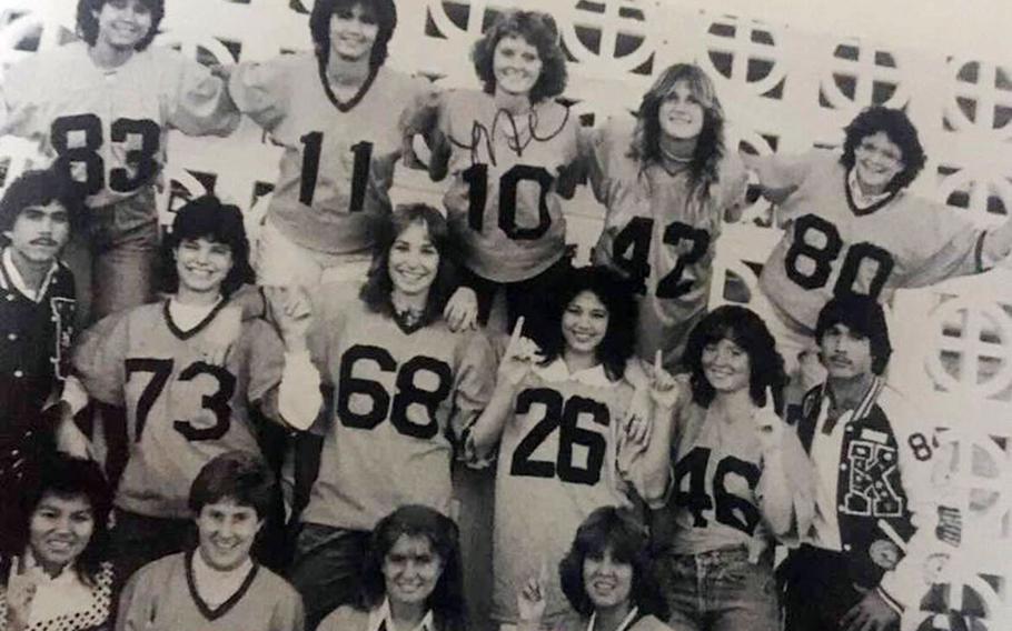 Debbie Mills, top center, poses with classmates from Kubasaki High School at Camp Foster, Okinawa, in the early 1980s. 