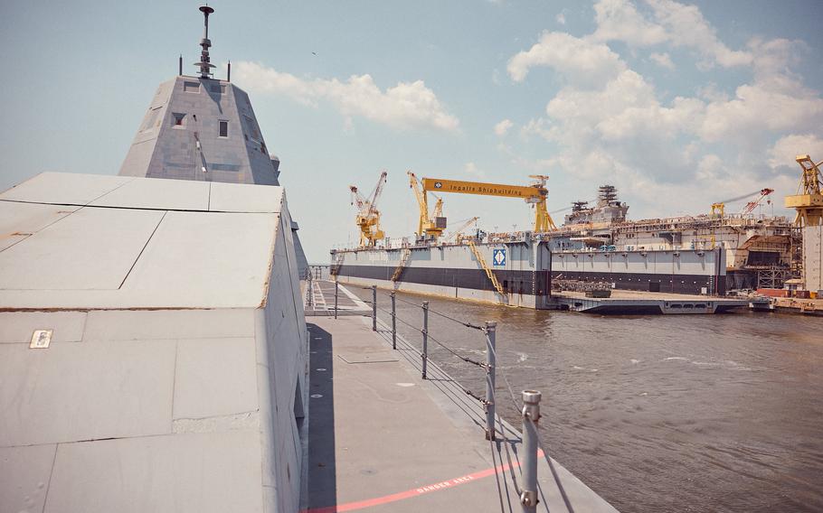 The guided missile destroyer USS Zumwalt prepares to approach the pier during the final stage of its inbound transit to Huntington Ingalls Shipyard in Pascagoula, Miss. 