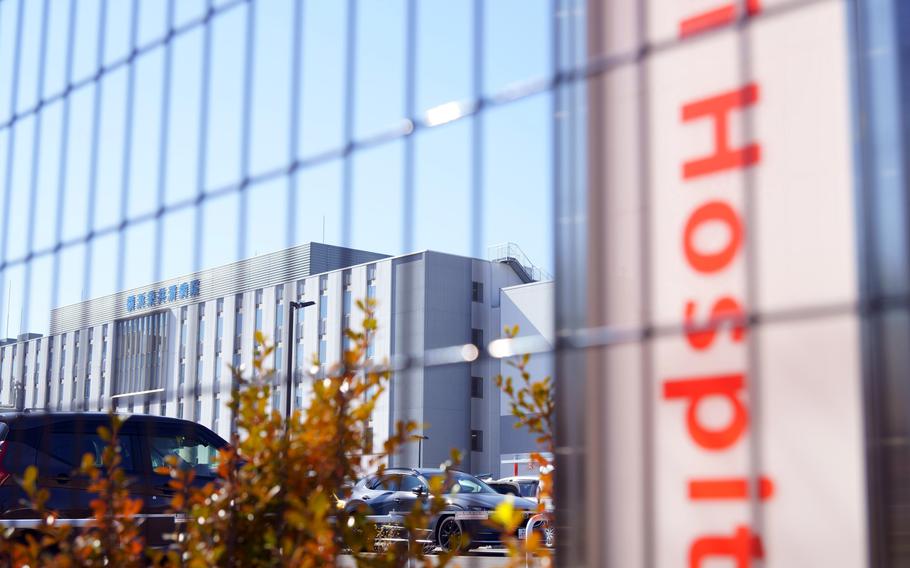 The word hospital is written in red on a sign.