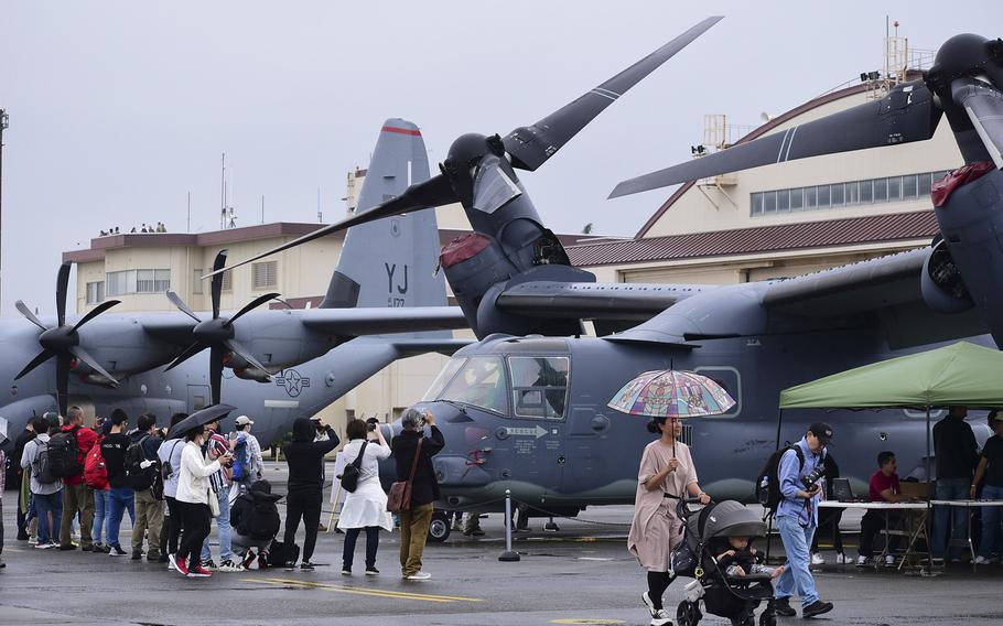 Friendship Festival visitors check out a C-130J Super Hercules and CV-22 Osprey at Yokota Air Base in western Tokyo, Saturday, May 20, 2023. 