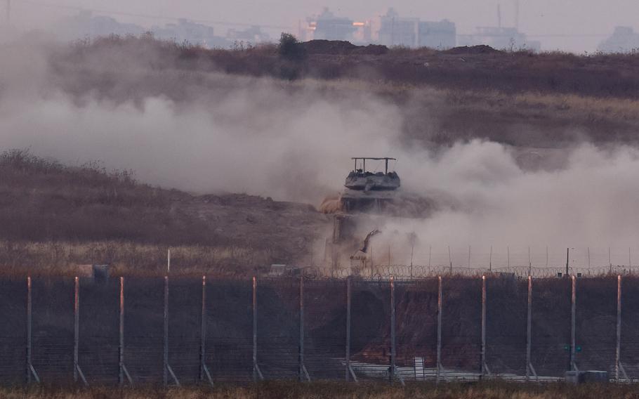 An Israeli tank maneuvers inside Gaza amid the ongoing conflict between Israel and Hamas, as seen from Israel, May 28, 2024. 