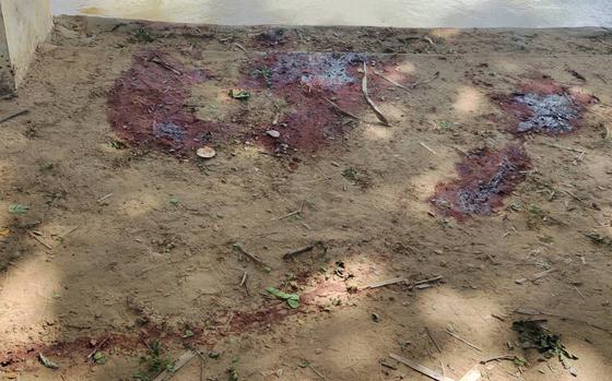 Dried blood stains cover on the floor of a middle school in Let Yet Kone village in Tabayin township in the Sagaing region of Myanmar on Saturday, Sept. 17, 2022, the day after an air strike hit the school. 