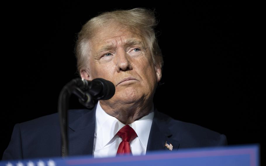 Former President Donald Trump pauses while speaking at a rally at the Minden Tahoe Airport in Minden, Nev., on Oct. 8, 2022.  