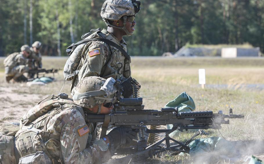 U.S. Soldiers assigned to the 66th Military Intelligence Brigade fire M240 machine guns during the U.S. Army Europe and Africa Best Squad competition at Grafenwoehr Training Area, Germany, Aug. 11, 2022.