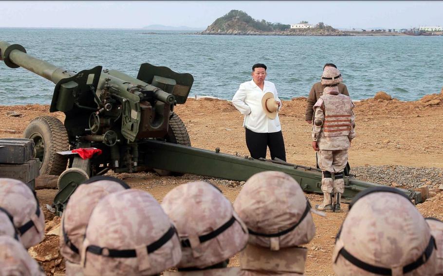 North Korean leader Kim Jong Un observers a military drill in this image released by the state-run Korean Central News Agency on Oct. 10, 2022. 