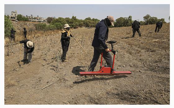 A member of the National Search Commission uses a ground-penetrating radar in an area where volunteers said they have found a clandestine crematorium in Tlahuac, on the edge of Mexico City, Wednesday, May 1, 2024. Ceci Flores, a leader of one of the groups of so-called "searching mothers" from northern Mexico, announced late Tuesday that her team had found bones around clandestine burial pits and ID cards, and prosecutors said they were investigating to determine the nature of the remains. (AP Photo/Ginnette Riquelme)