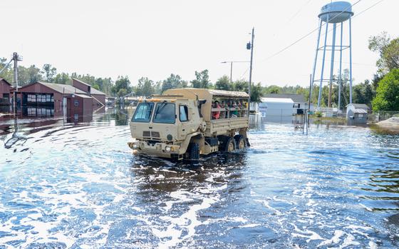 S.C. Gov. Henry McMaster assesses damages in Nichols, S.C., on a South Carolina National Guard high water vehicle, Sept. 22, 2018. McMaster flew to Nichols after major flooding enveloped the town as a result of heavy rains and run-off waters after Hurricane Florence.



(U.S. Army National Guard Photo by Staff Sgt. Jorge Intriago)