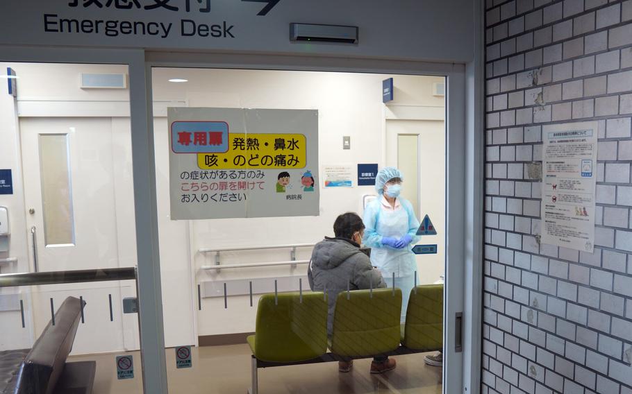 A patient waits to be seen by doctors at Tokyo Metropolitan Hiroo Hospital, Feb. 21, 2023.