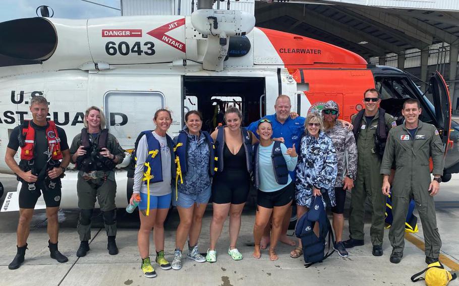 A Coast Guard Air Station Clearwater MH-60 Jayhawk helicopter aircrew rescued seven people after their 39-foot personal vessel was struck by lightning 100 offshore of Clearwater Florida, June 25, 2022. The five women and two men were returned without medical concerns to the air station where family greeted them.
