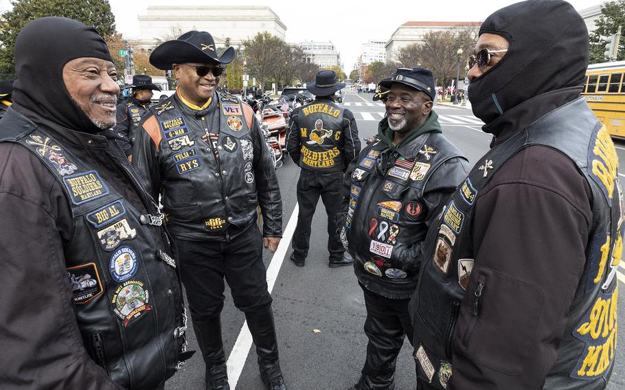 Riders from the Maryland-based Buffalo Soldiers Motorcycle Club relax before riding in the National Veterans Day Parade on Sunday, Nov. 12, 2023, in Washington. 