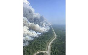 In this photo released by the British Columbia Wildfire Service, a 2,000 hectares planned ignition is successfully completed on the Stoddart Creek wildfire, on Saturday, May 20, 2023, in Stoddart Creek, British Columbia. The operation achieved its objective of removing unburnt, highly susceptible understory fuels and timber between the fire's westernmost edge and Highway 97 and has reduced the likelihood of further spread west across the highway.  (Scott Reynolds/British Columbia Wildfire Service via The Canadian Press via AP)