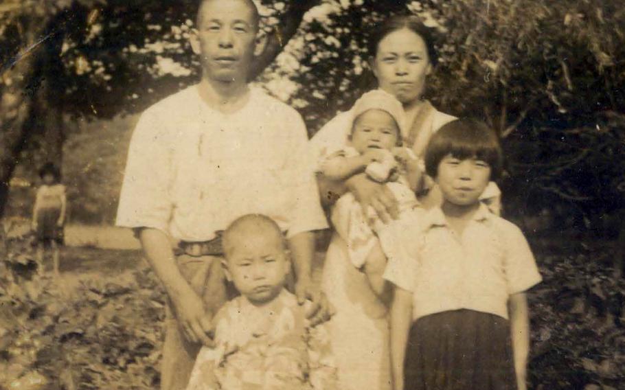 This portrait of a couple with three young children was among photographs recovered by a fallen Marine from a Pacific battlefield during World War II.