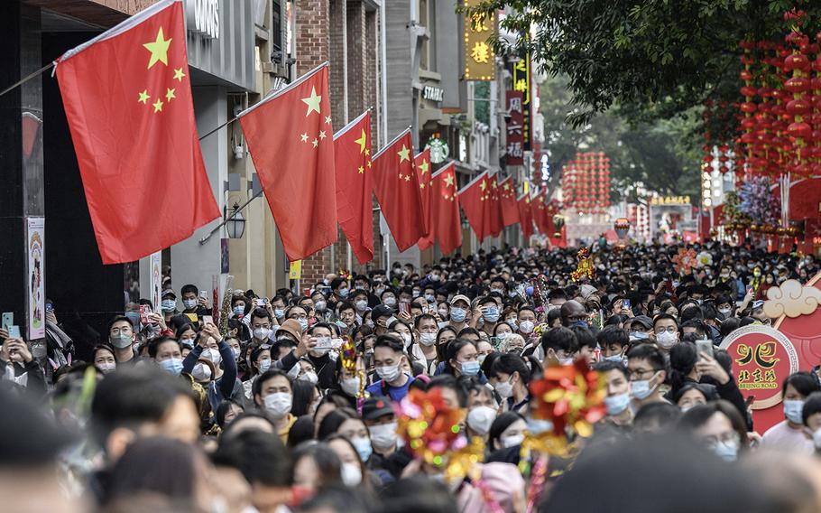 People visit a traditional Spring Festival flower market which reopens after closure due to the spread of the COVID-19 coronavirus in Guangzhou, China, on Jan. 20, 2023, ahead of Lunar New Year festivities. 