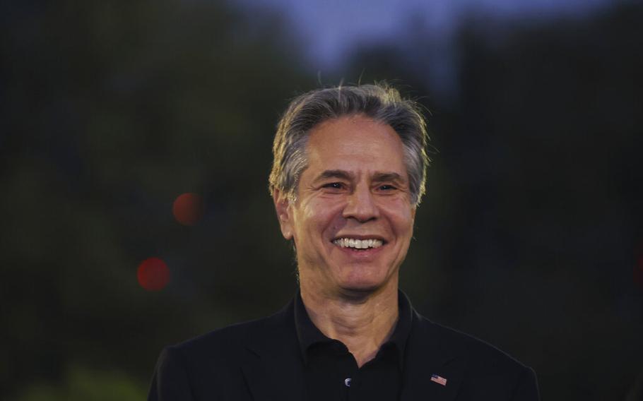 U.S. Secretary of State Anthony Blinken reacts as he listens to a youth representative during a visit to Oxygen Park at Education City, in Doha Qatar, on Monday, Nov. 21, 2022. 